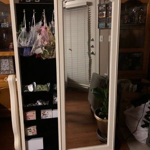 Jewelry organizer with sliding door mirror